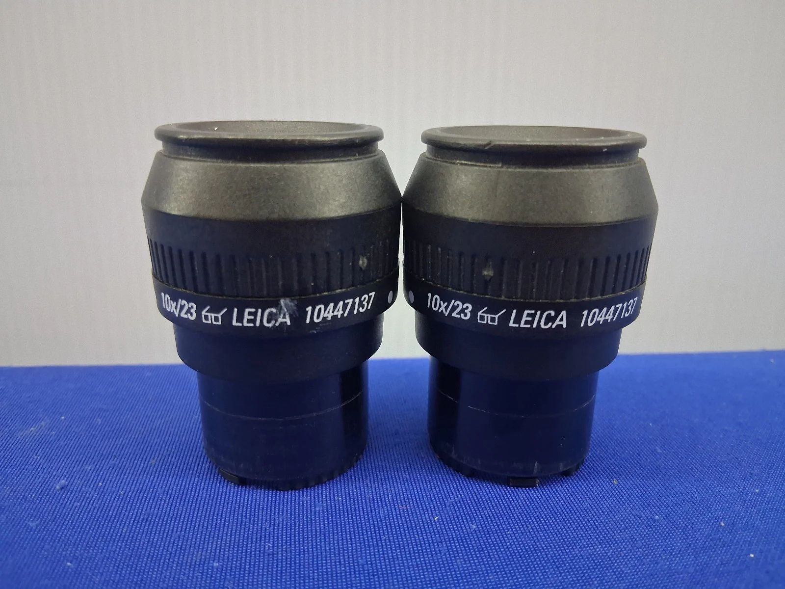 PAIR OF LEICA 10447137 10X/23 EYEPIECES STEREO ZOOM SELLING A 1 LOT OF QTY. 2